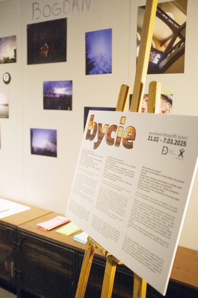A wall showcasing a variety of photographs in an organized display, highlighting different themes and styles.