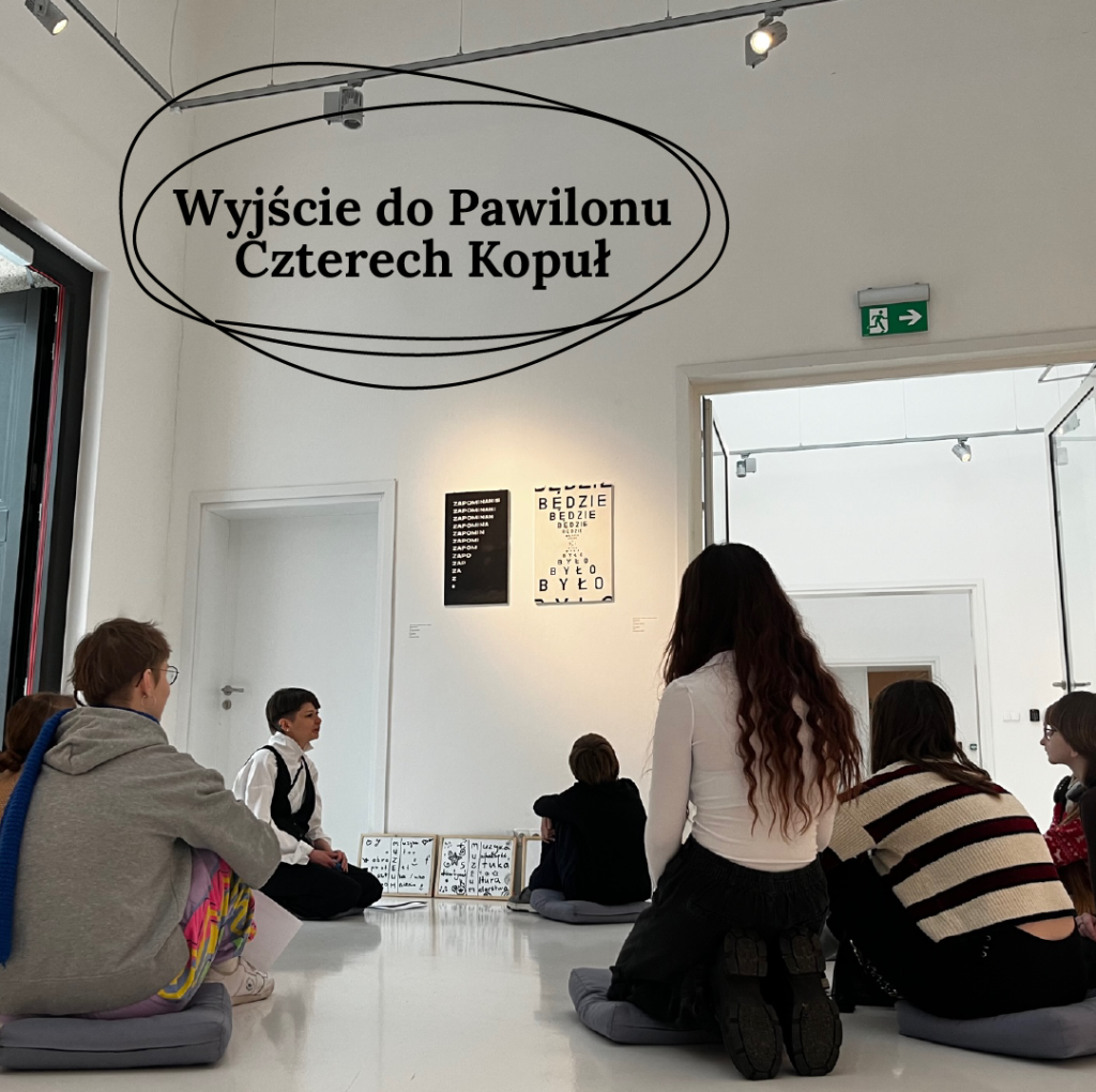 A group of teenagers sitting on the floor in an art gallery, engaging in discussion and observing the artwork around them. The caption on the photo reads "Visit to the Four Domes Pavilion."